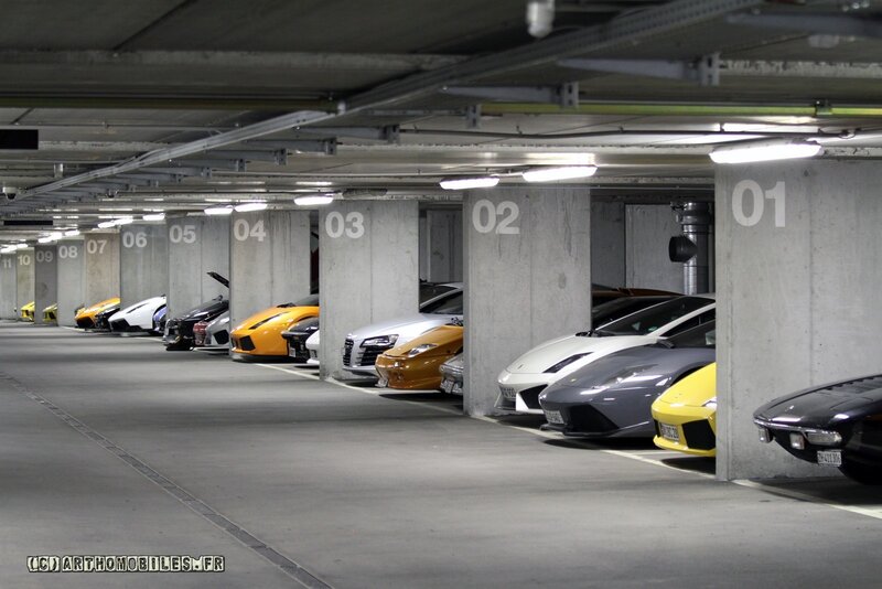 Luxury cars in a parking garage