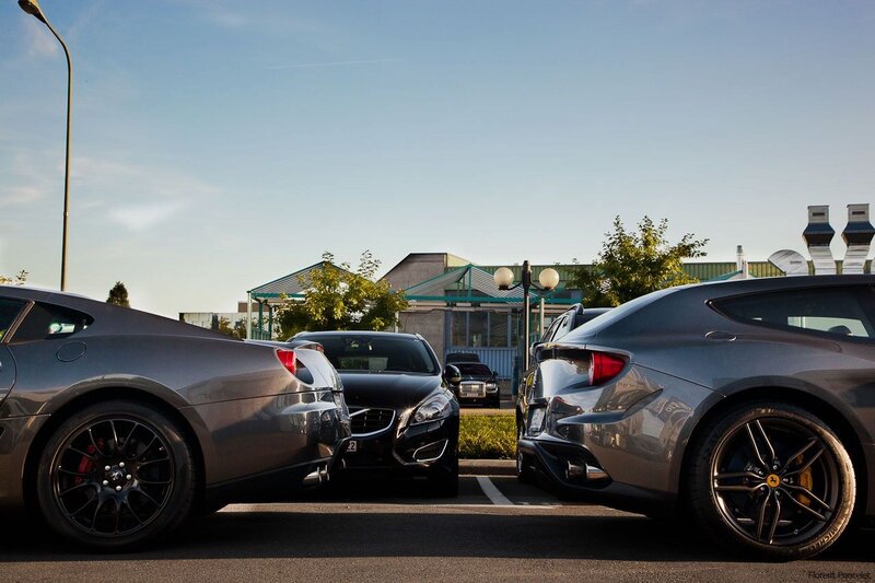 Luxury cars in a parking lot