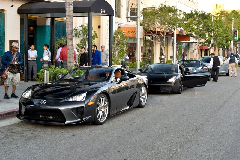 Luxury cars on a city street