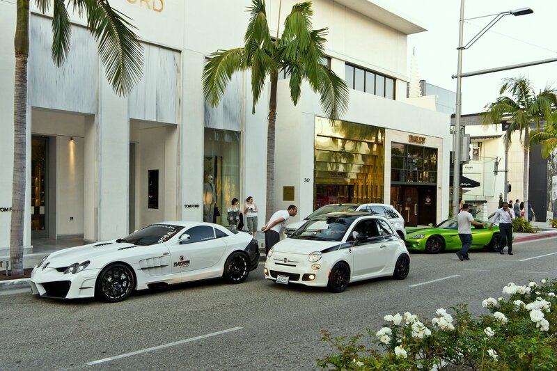 Luxury cars on a city street