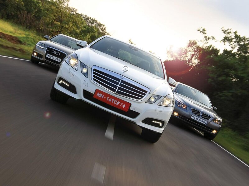luxury cars on a road