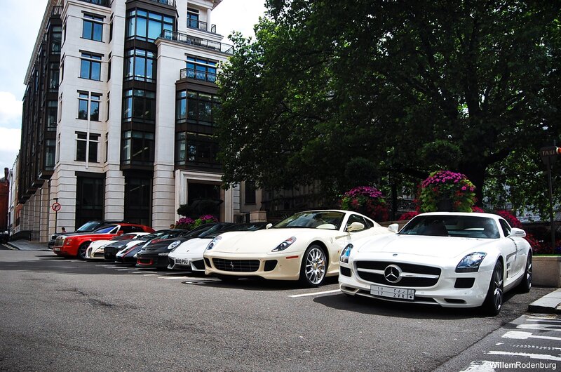 Luxury cars parked on a city street