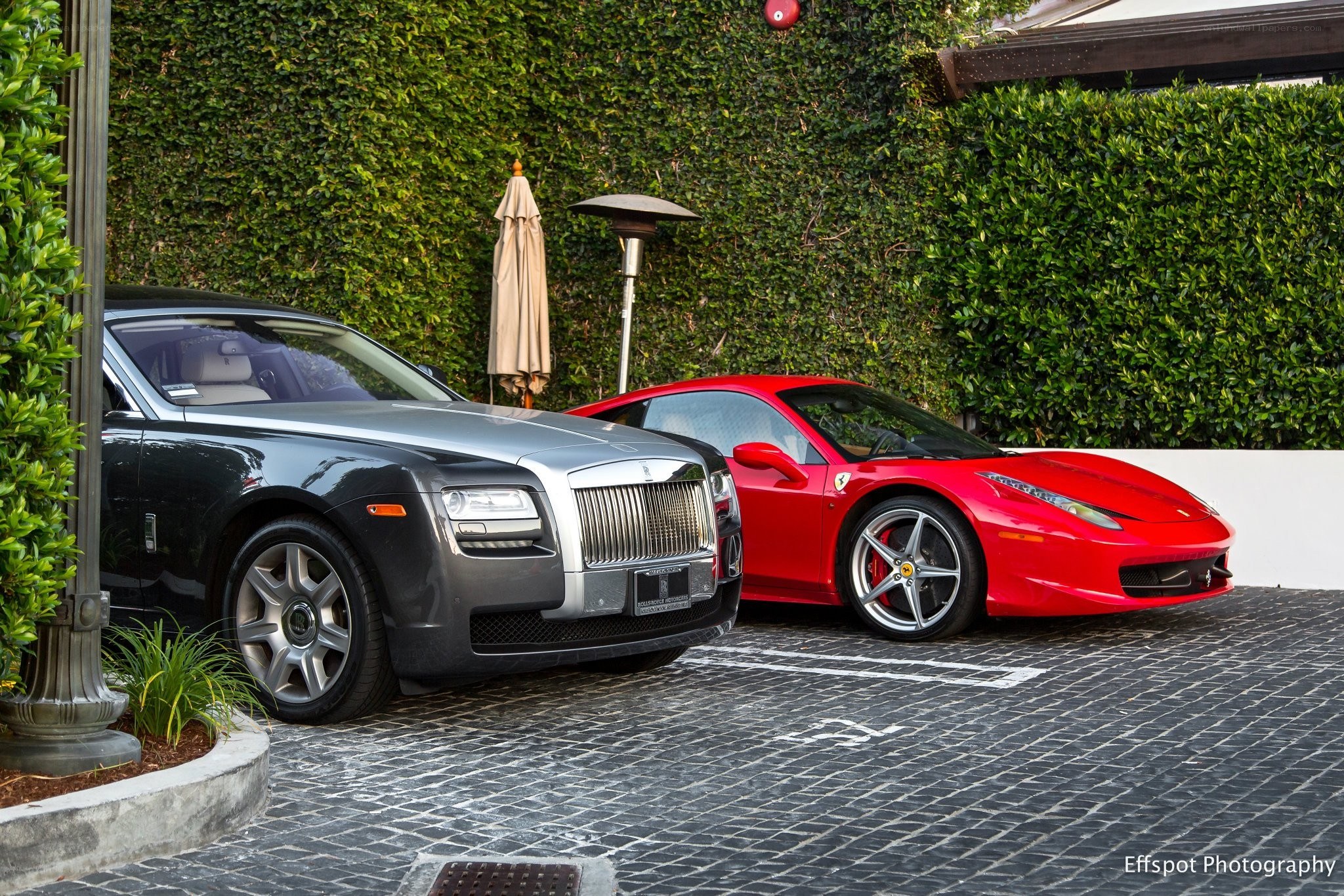 Luxury cars parked outside