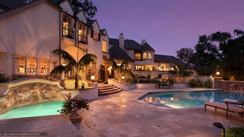 Luxury home at dusk with pool