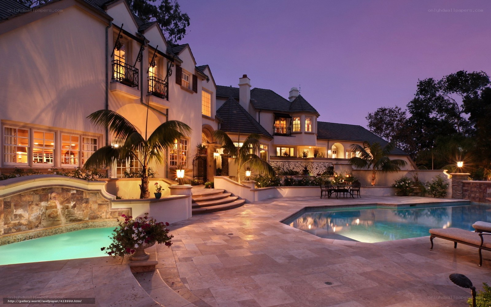 Luxury home at dusk with pool