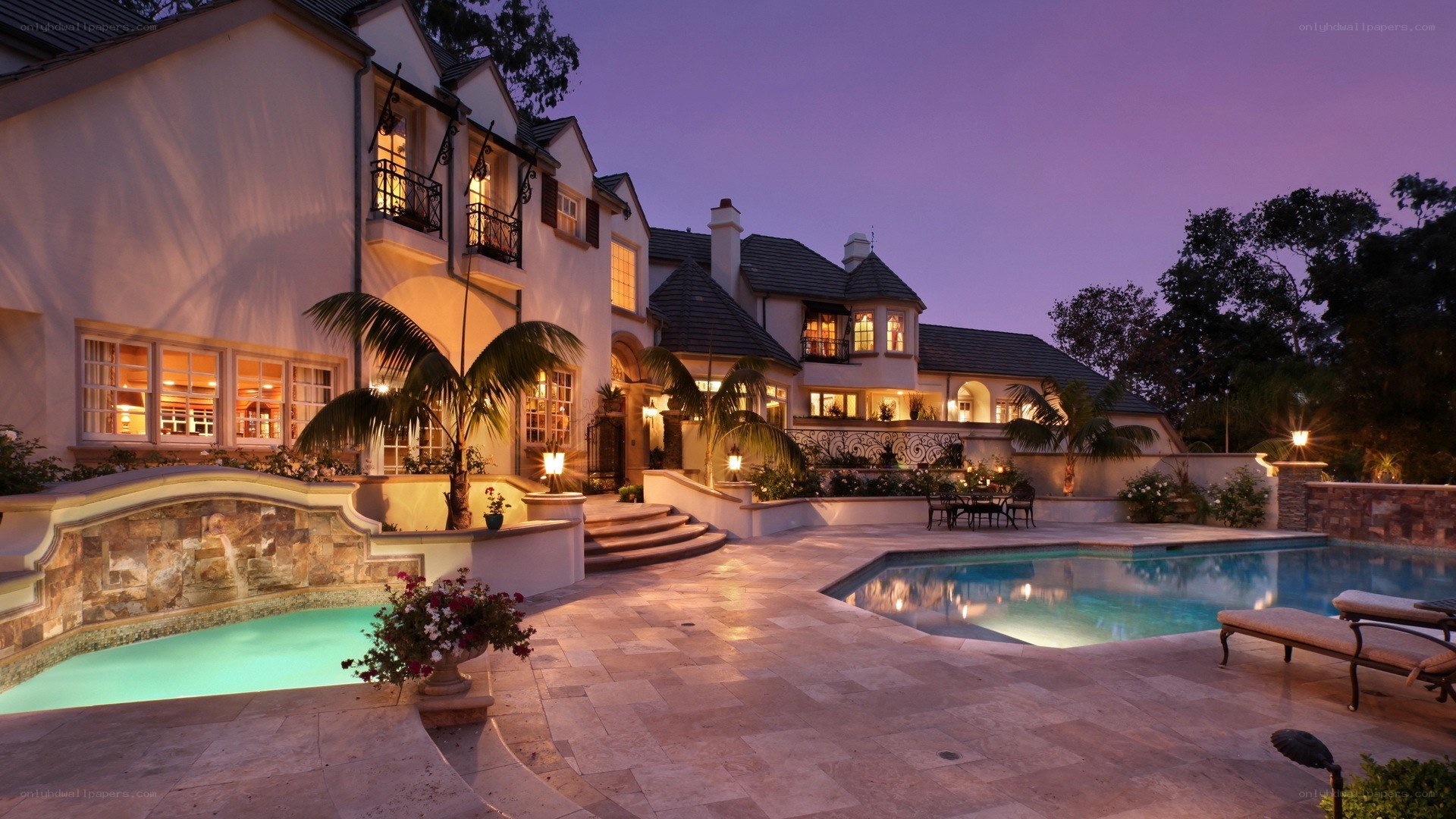 Luxury home with pool at dusk