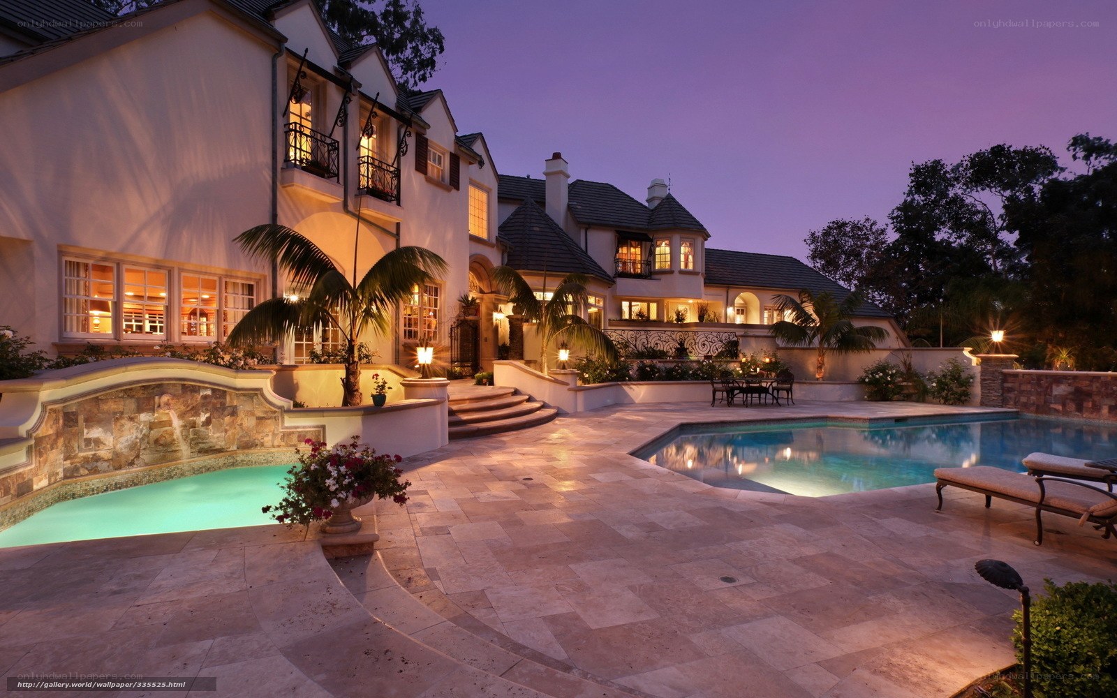 Luxury home with pool at dusk