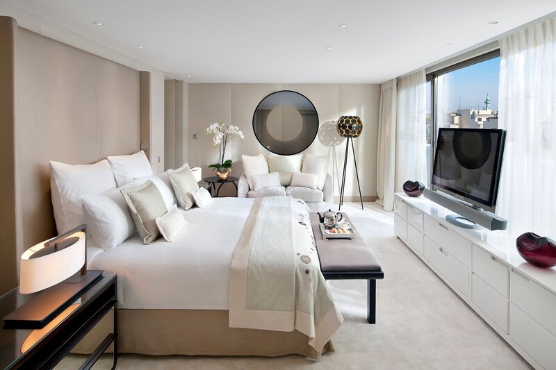 Luxury hotel bedroom with city view