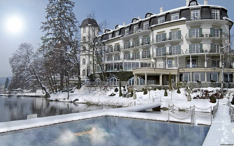 Luxury hotel by a snowy lake