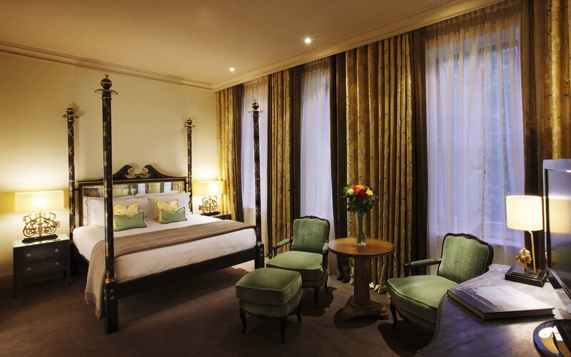 luxury hotel room with four-poster bed