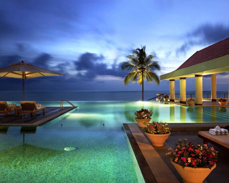 Luxury pool at dusk by the sea