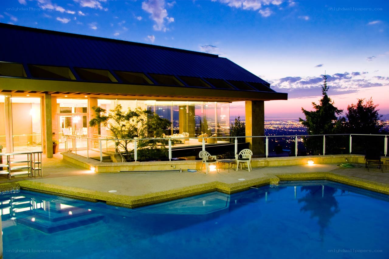 Luxury pool at dusk with city view