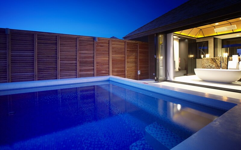 Luxury pool villa at dusk