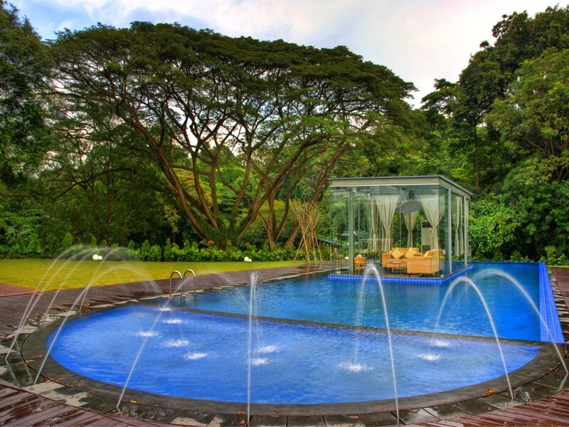 Luxury pool with fountain and glass pavilion