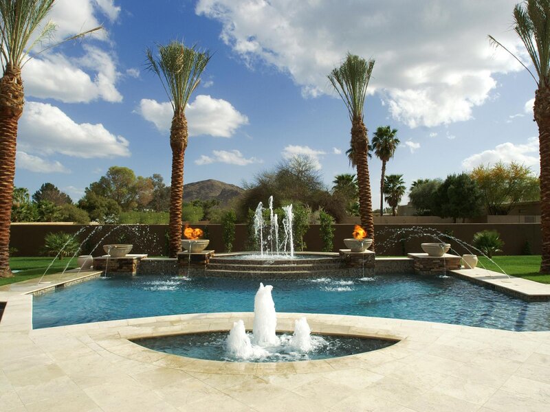 Luxury pool with fountains and palm trees