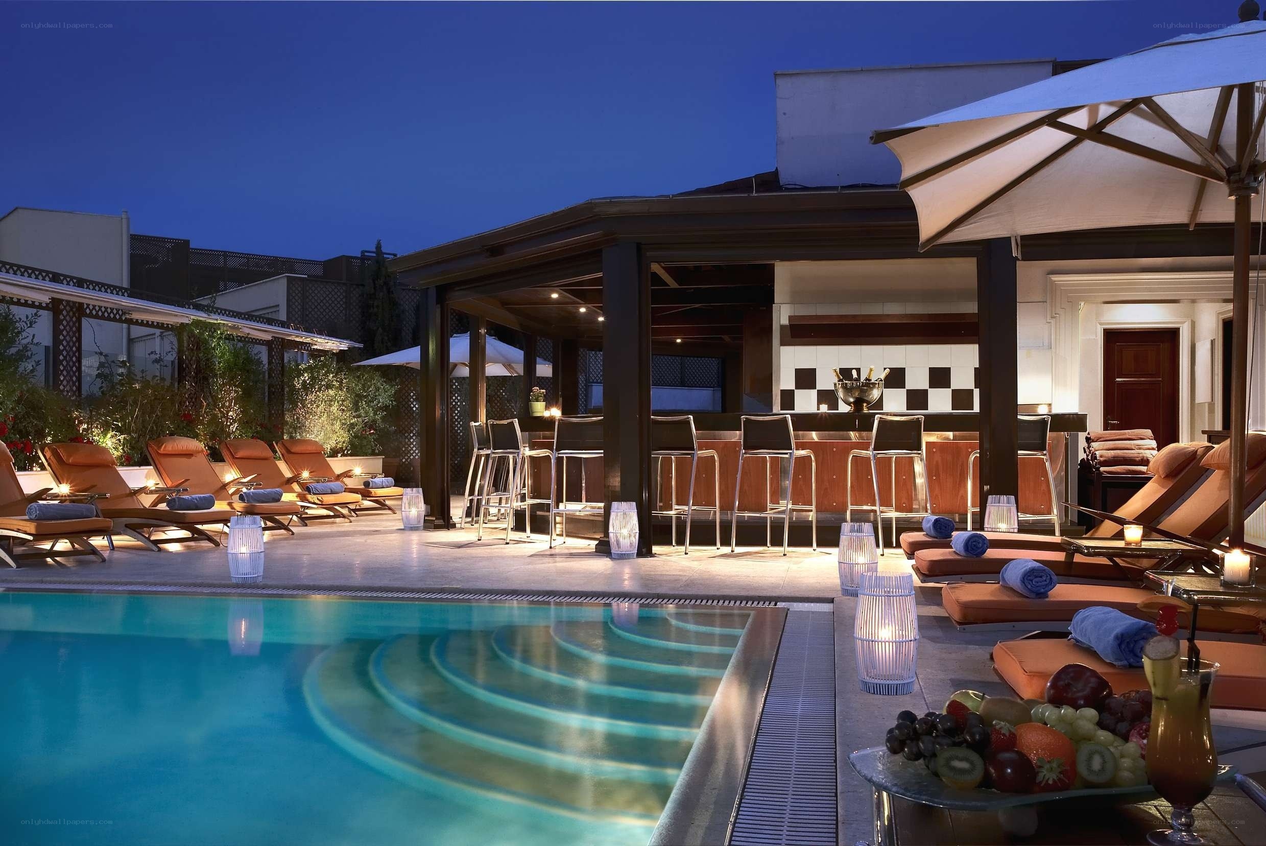 Luxury poolside bar at dusk