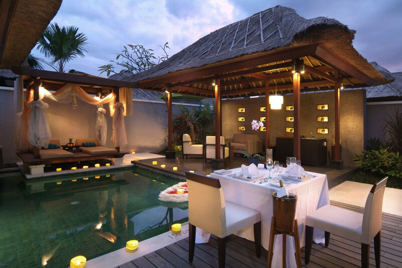 Luxury poolside dining at dusk