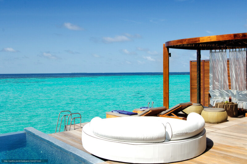 Luxury poolside lounge by the ocean