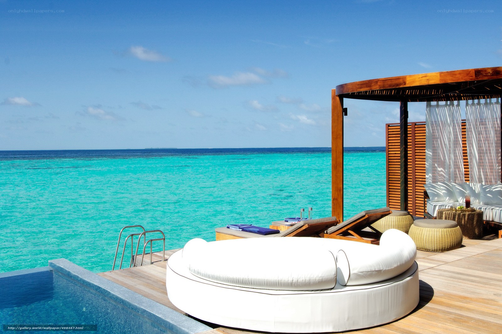 Luxury poolside lounge by the ocean