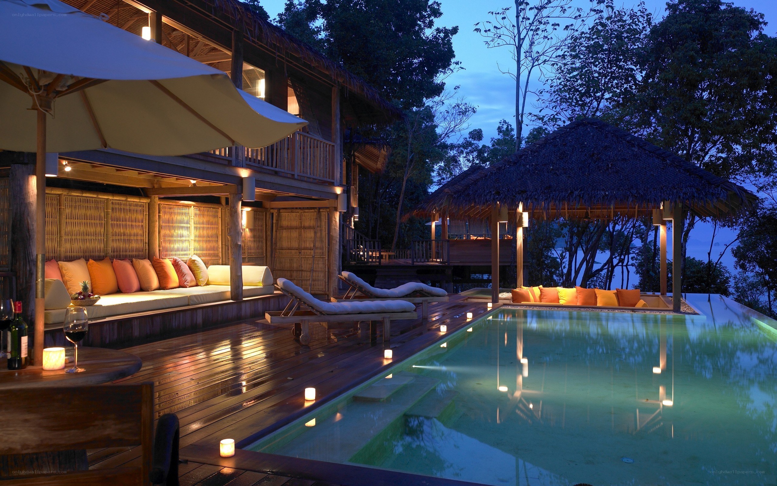 Luxury poolside resort at dusk