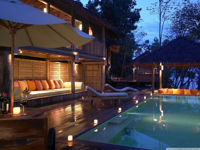 Luxury poolside villa at dusk