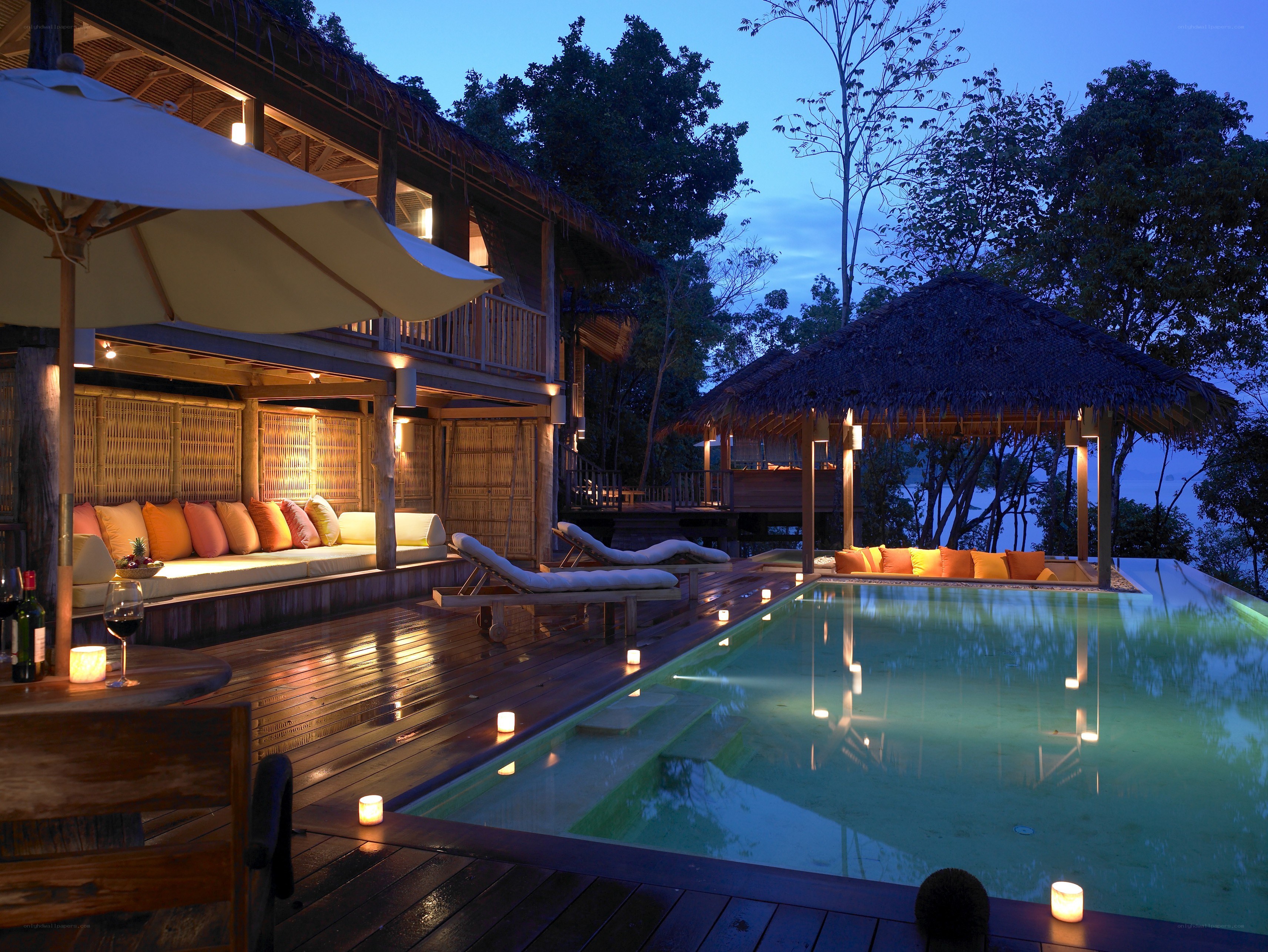 Luxury poolside villa at dusk