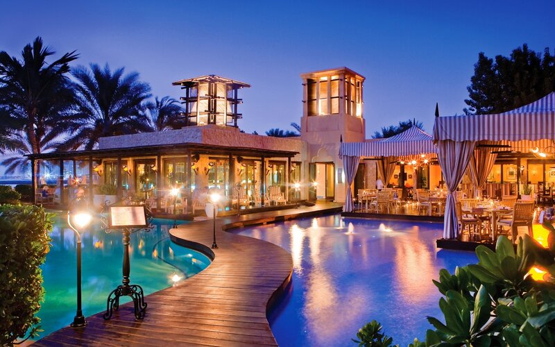 Luxury Resort Pool Area — Blue, Serene, Night, Photograph, Palm Trees, Restaurant