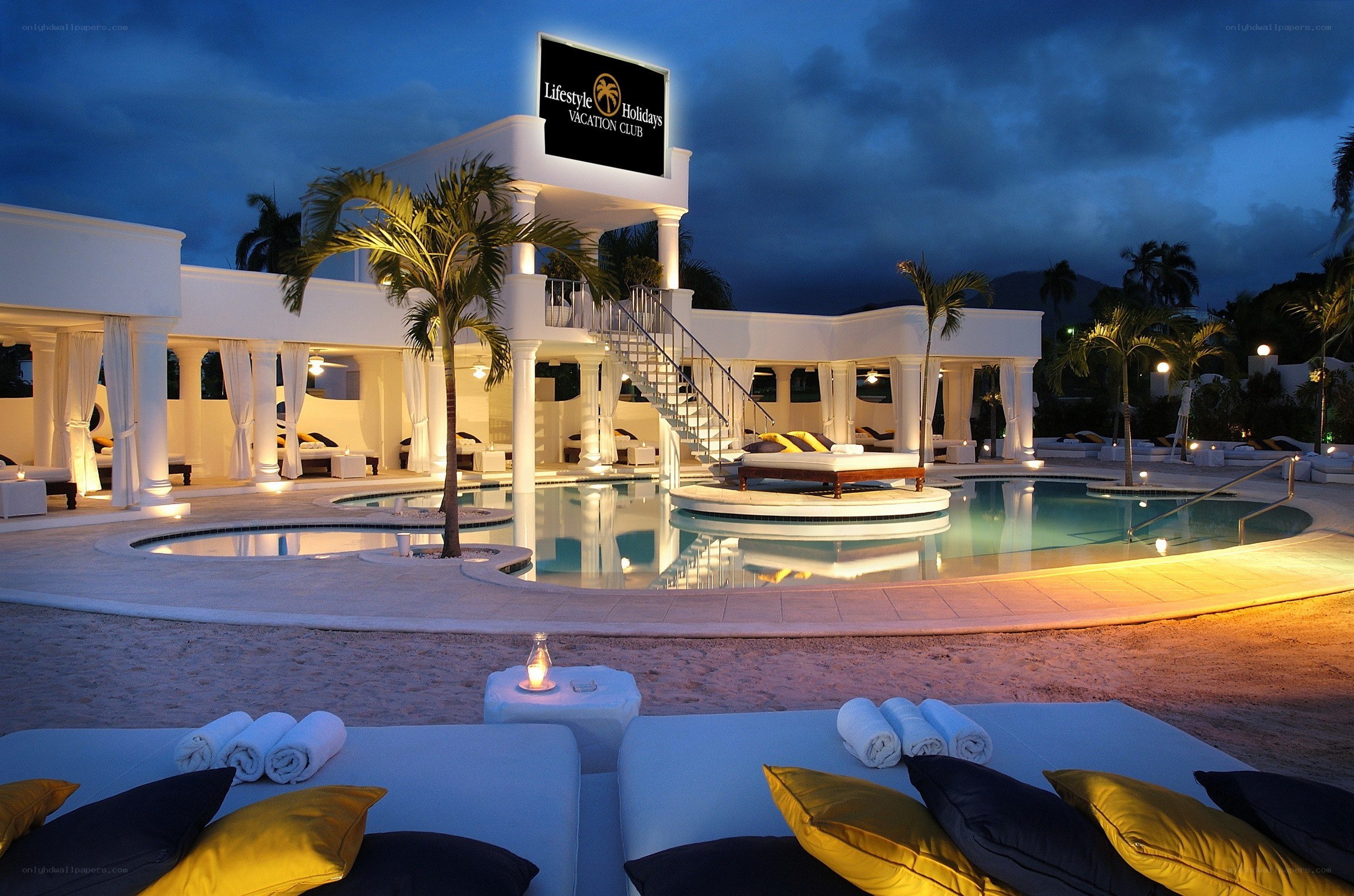 luxury resort pool at dusk