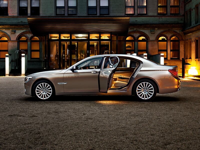 Luxury sedan at hotel entrance