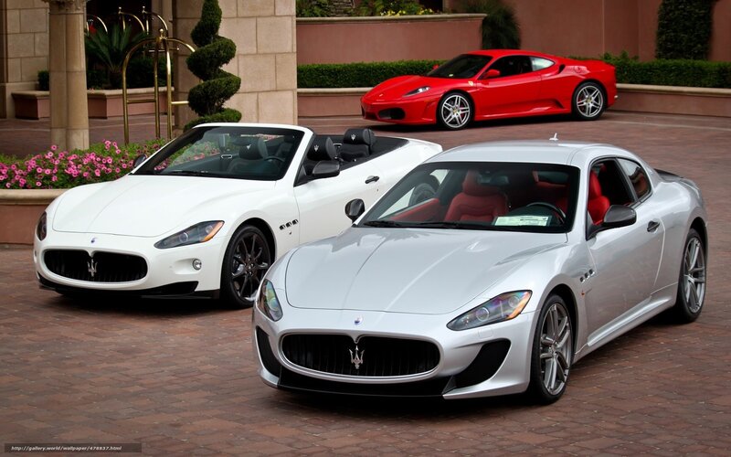 Luxury sports cars at a resort