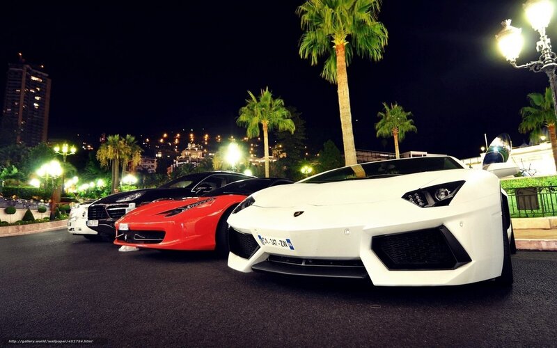 Luxury sports cars at night
