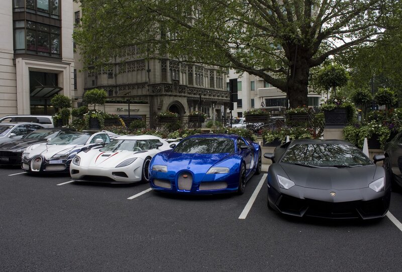 luxury sports cars in a city