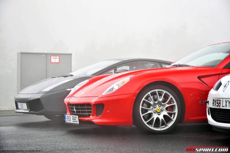 Luxury sports cars in fog