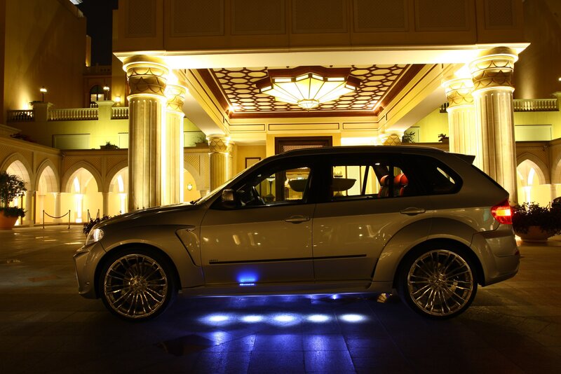 Luxury SUV at hotel entrance