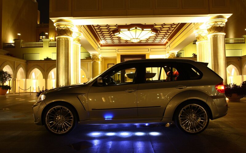 Luxury SUV at hotel entrance