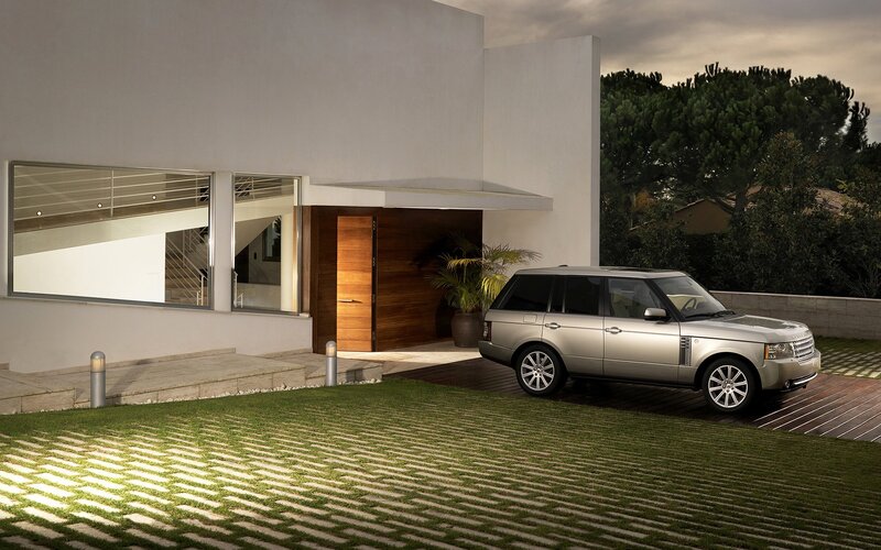 Luxury SUV at modern home