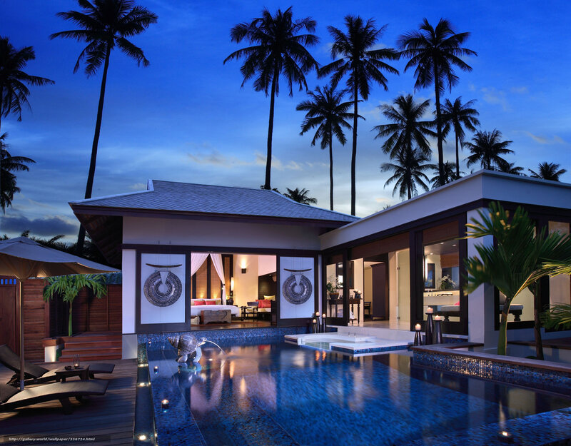 Luxury villa at dusk with pool