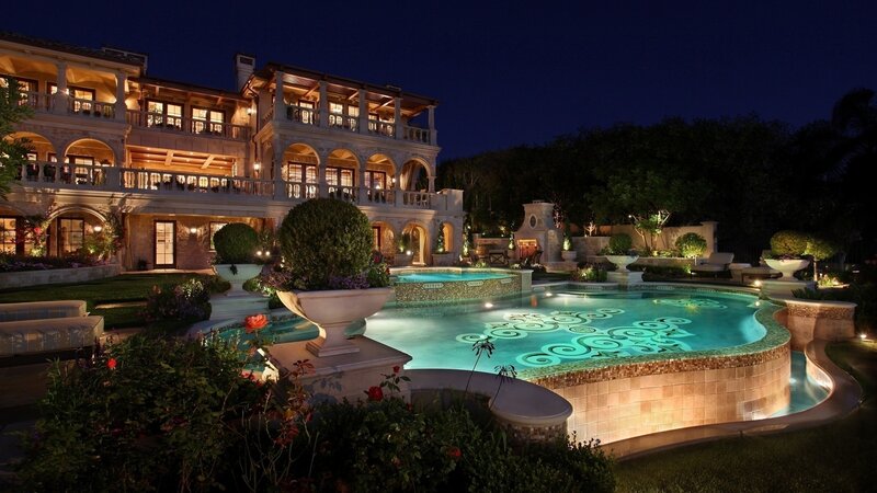 luxury villa at night with pool