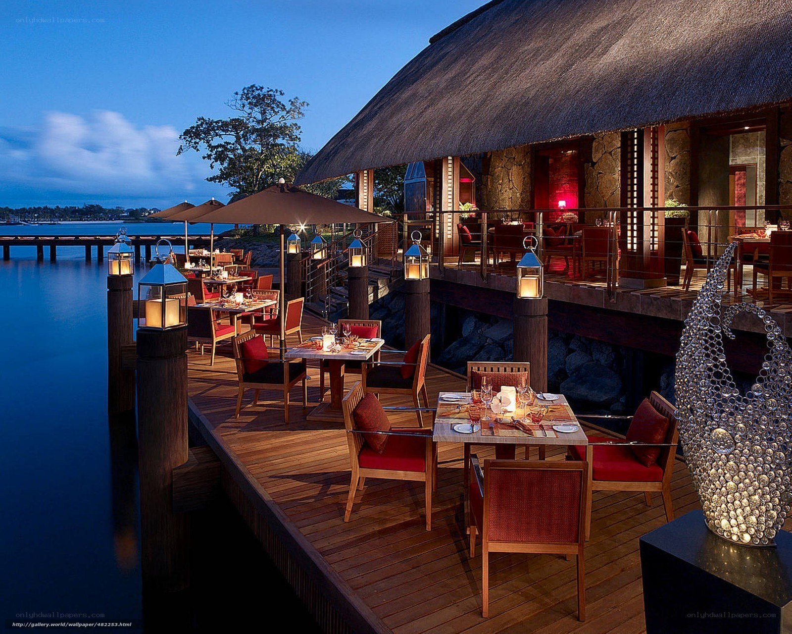 luxury waterfront restaurant at dusk
