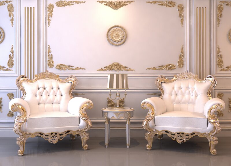 luxury white armchairs in ornate room