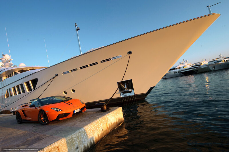 Luxury yacht and sports car