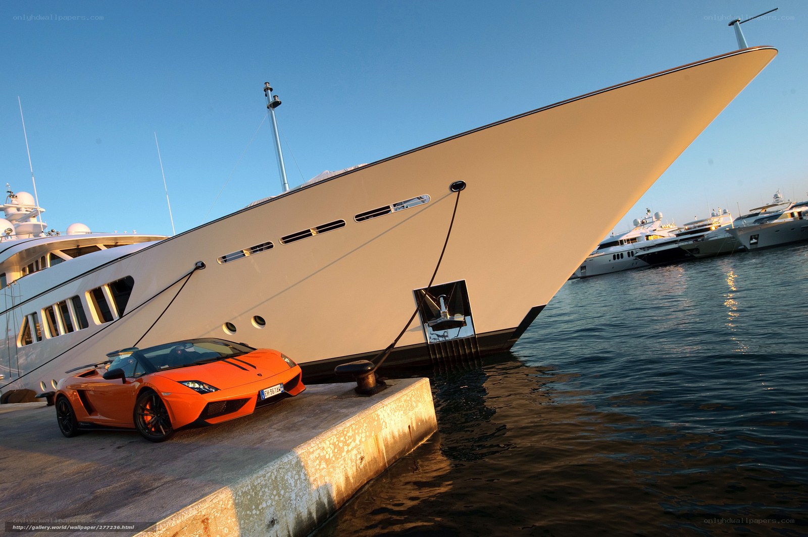 Luxury yacht and sports car