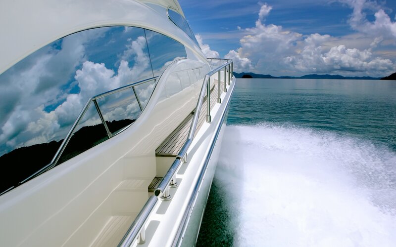 Luxury yacht speeding on the water
