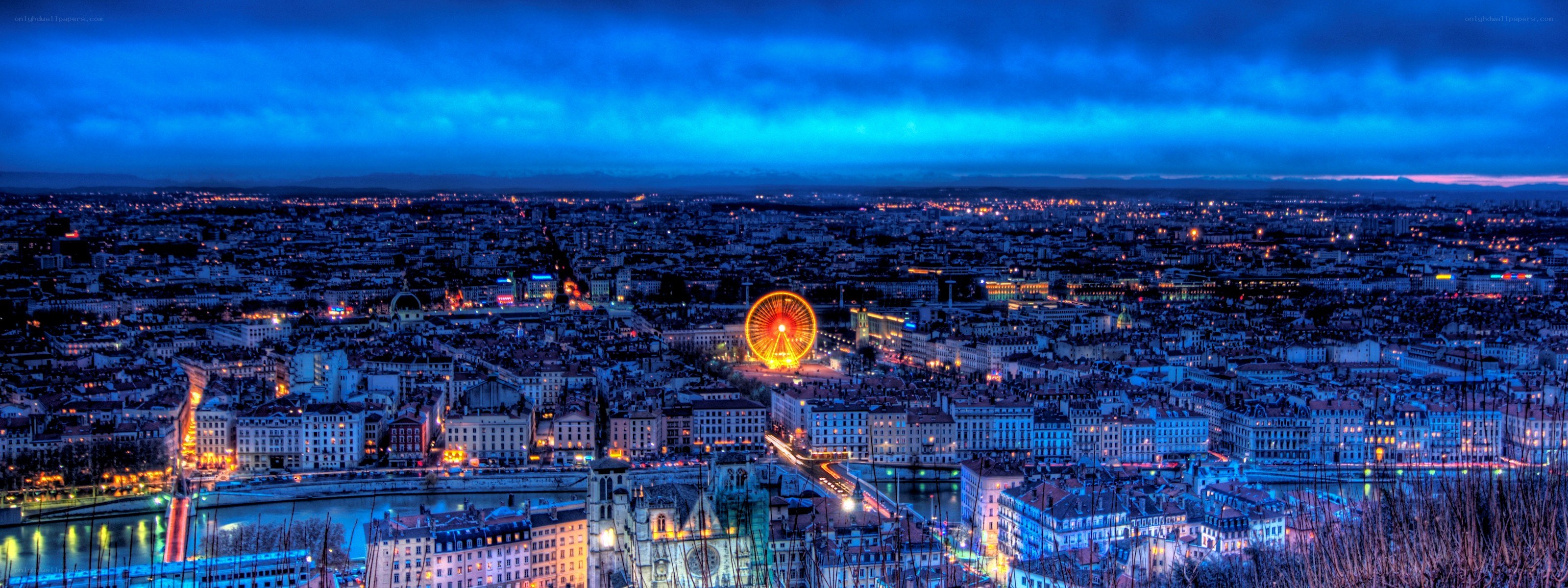 Lyon at dusk with Ferris wheel