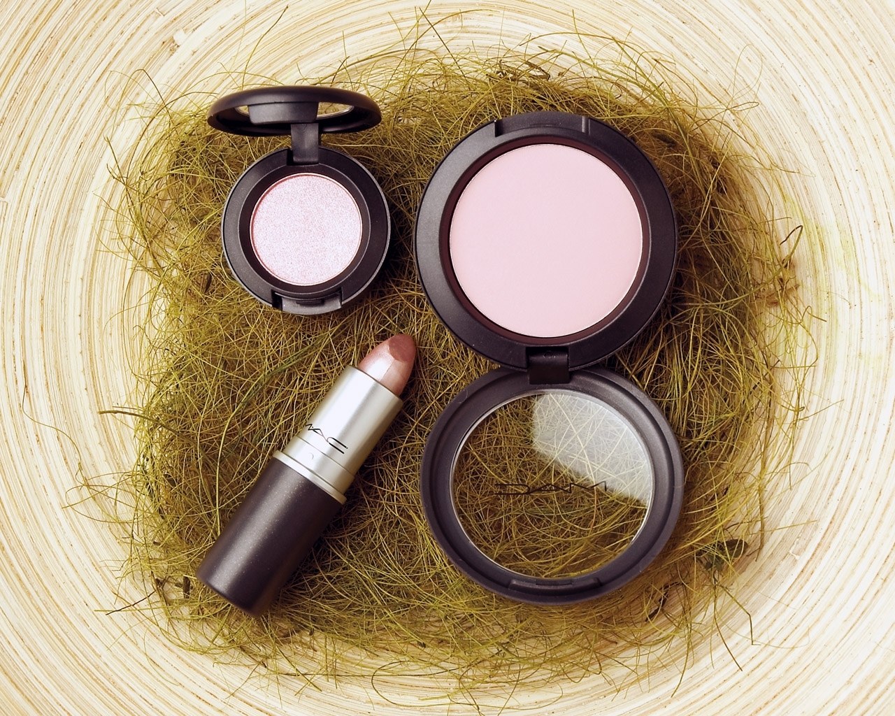 MAC cosmetics on hay