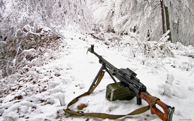 Machine gun in snowy forest