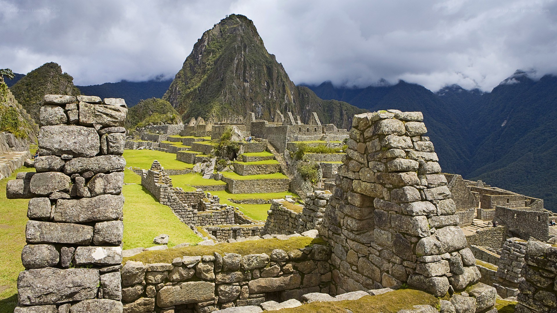 Machu Picchu ruins with mountain
