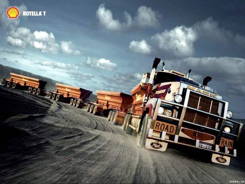 Mack truck convoy on dirt road