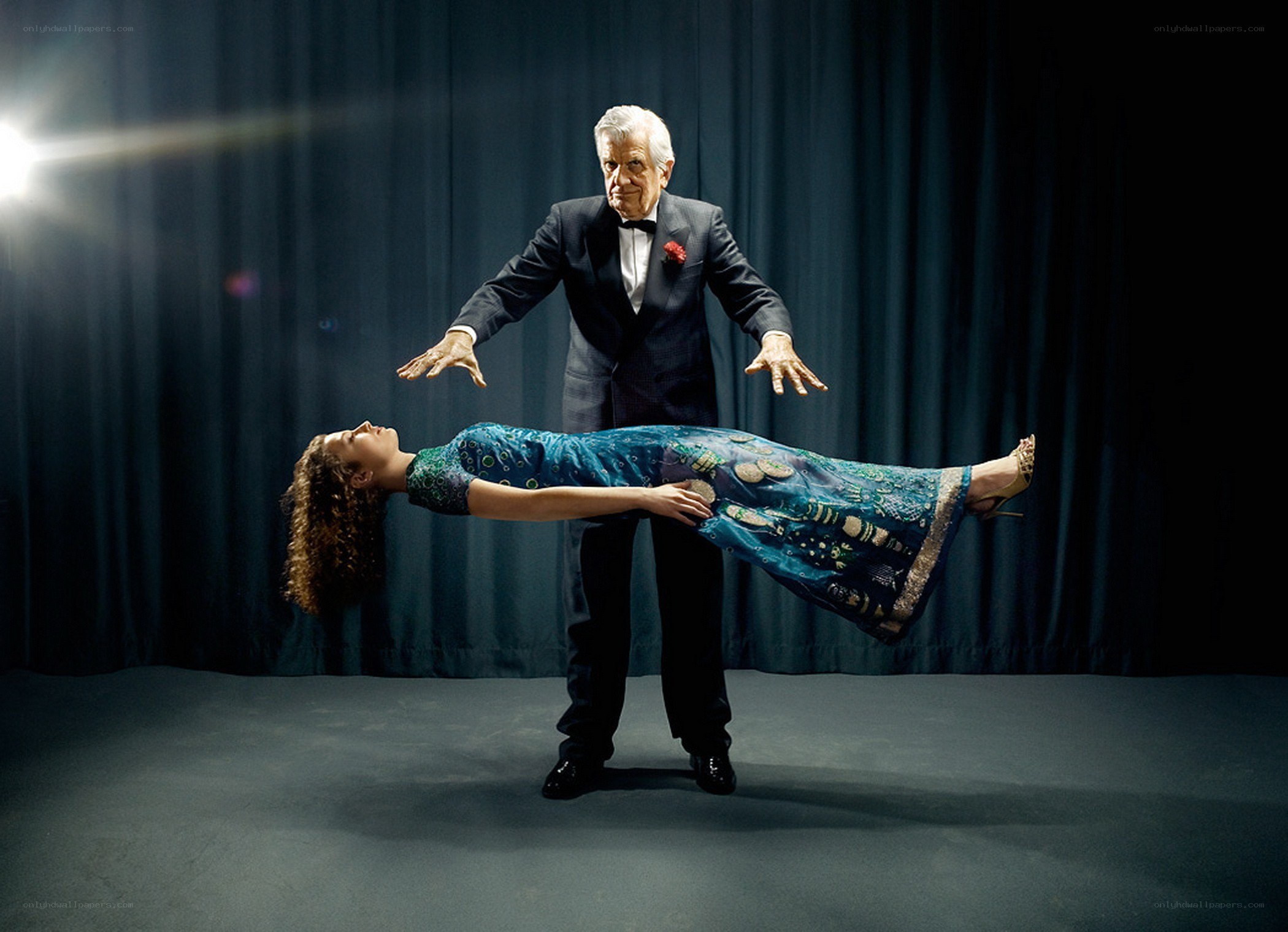 Magician performing levitation illusion