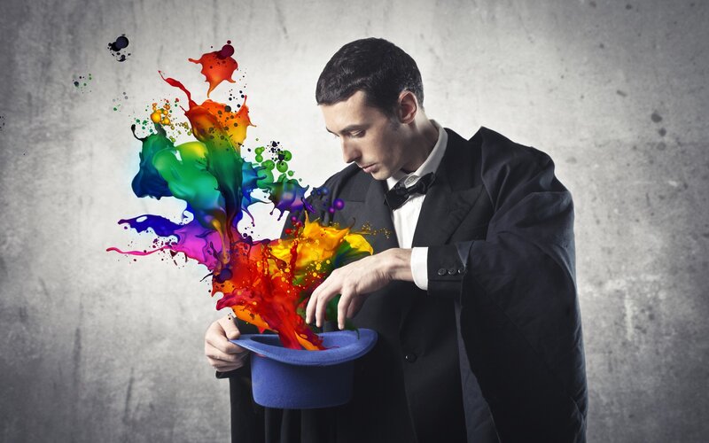 magician with colorful paint